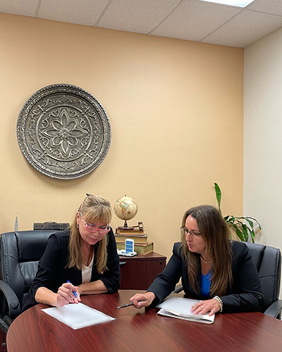 Photo of attorney Cynthia I. Waisman and Client