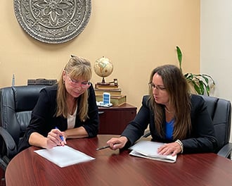 Photo of attorney Cynthia I. Waisman and Client